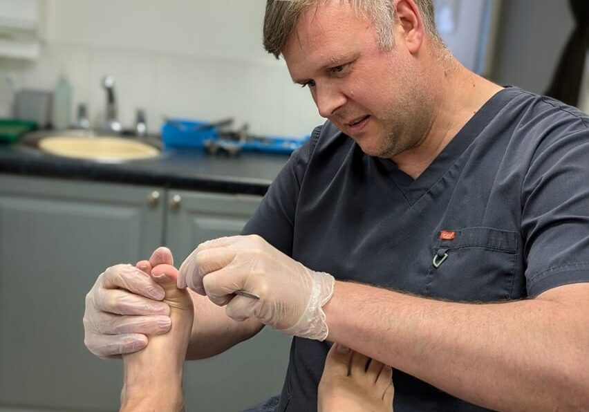 chapeltown-foot-clinic-sheffield-podiatry-chiropody-Graeme-Podiatrist Graeme Carter-Wood, podiatrist at Chapeltown Foot Clinic, Sheffield treating a patient
